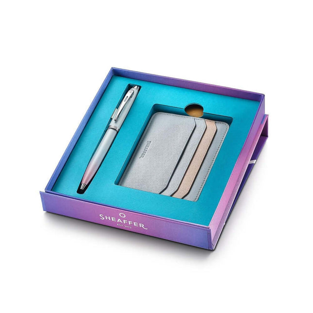 Sheaffer Expressions gift set with blue and pink ballpoint pen and leather credit card holder in a colorful box.
