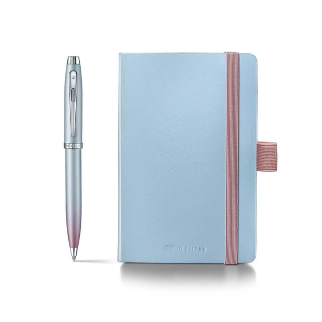 Sheaffer Expressions 100 gift set featuring a blue and pink ballpoint pen and a small notebook.