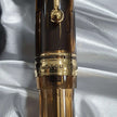 Pilot Custom 823 Amber Brown GT Fountain Pen close-up showing gold trim and amber barrel.