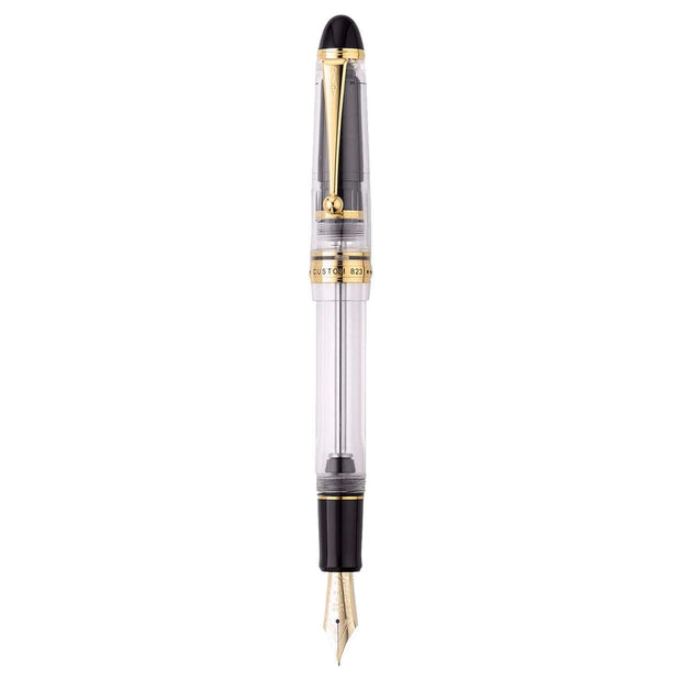 Pilot Custom 823 Clear GT Fountain Pen with clear barrel and gold trim showcasing its elegant design.