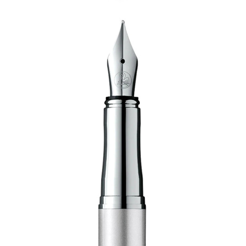 Close-up of the nib of a Pelikan Jazz Silver CT Fountain Pen, showcasing its polished chrome design.