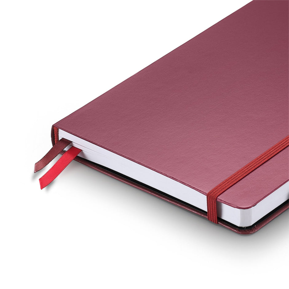 Sheaffer Echoes Of Red 90GSM Notebook with burgundy cover and red ribbon bookmarks.