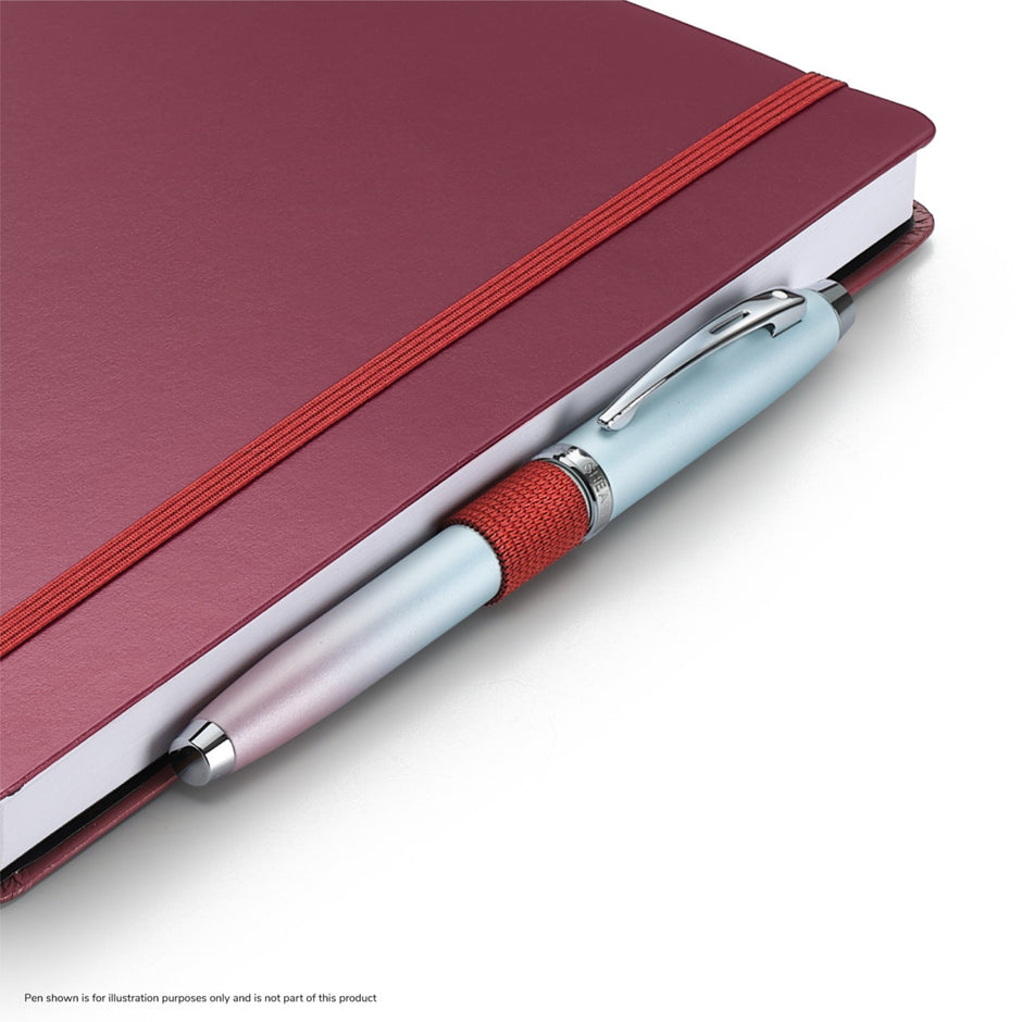 Sheaffer Echoes Of Red 90GSM Notebook with a pen, showcasing its burgundy cover and vibrant design.