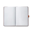 Sheaffer Echoes Of Red 90GSM Notebook open pages showcasing blank lined paper for creativity and expression.