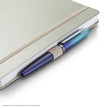 Sheaffer Nature's Muse 90GSM Notebook in light grey with a pen resting on the side, showcasing its elegant design.