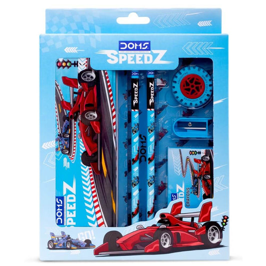 DOMS Speedz Stationery Kit with compass, eraser, sharpener, pencils, and crayons in a vibrant racing-themed package