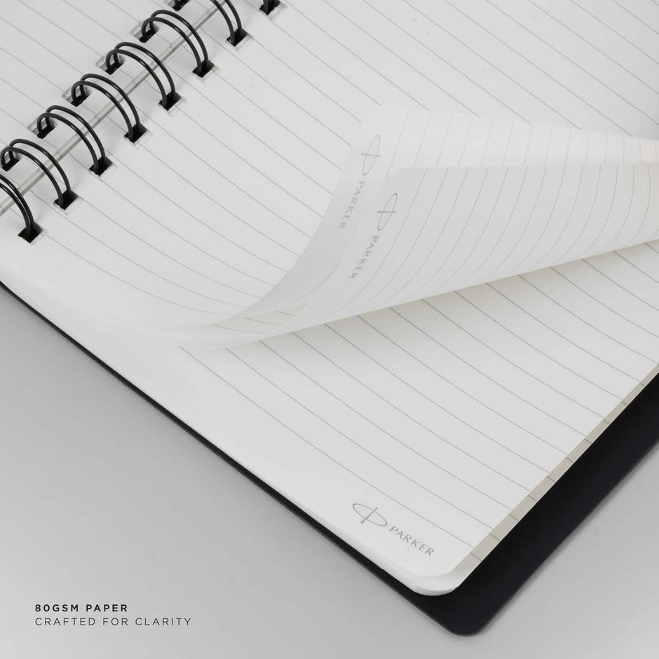 Parker Premium Wiro Note Book Silver with Blue Tabs | 4 Subject | Size - 10.8cm x 14cm showing interior pages and spiral binding.
