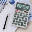 Flair FC-400 12 Digits Desktop Calculator on a desk with notebook and pen, showcasing its clear display and efficient design.