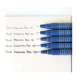 Pilot Drawing Pen Set of 5 displayed with different point sizes on a notepad, showcasing their vibrant ink.