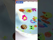 DOMS Floating Markers Set of 12 Shades showing colorful designs floating in water with a flat spoon.