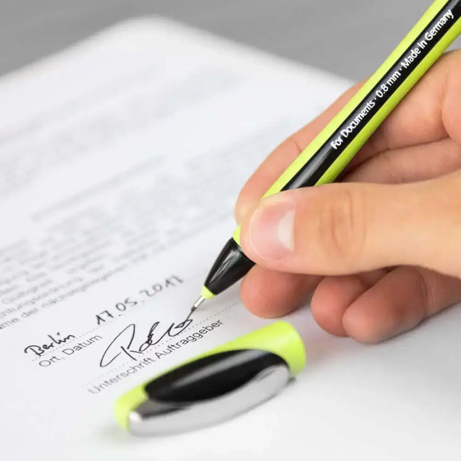 Schneider Xpress Fineliner 0.8 MM Pen signing a document with a hand, featuring a vibrant design.